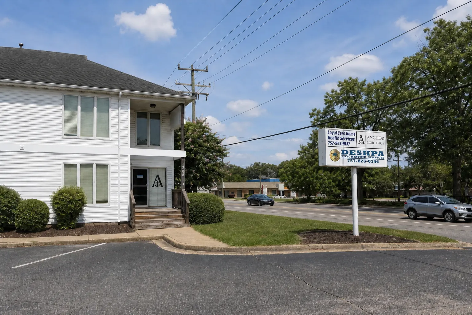 Grace Center and Anchor Mortgage shared roadside sign